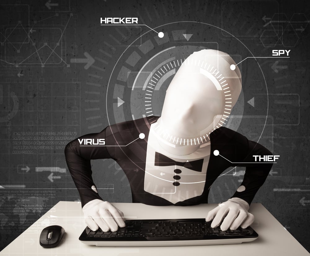 Hacker without identity in futuristic enviroment hacking personal information on tech background Hacker without identity in futuristic enviroment hacking personal information on tech background